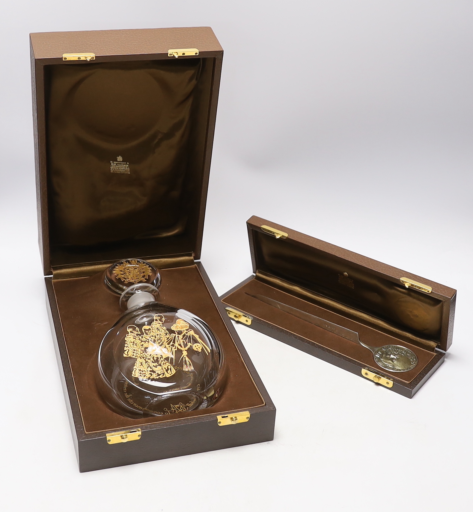 A Churchill commemorative silver letter opener and a commemorative Churchill decanter, Garrard & Co, boxed, letter opener 24.5cm long